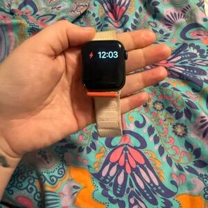 Apple Smartwatch with Black Face and Beige Band